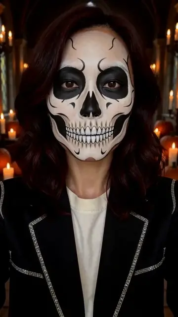 AI generated adult woman in a chest up portrait, changing from an unpainted face and white T-shirt to ivory and charcoal skull makeup and a black jacket in a candlelit gothic hall